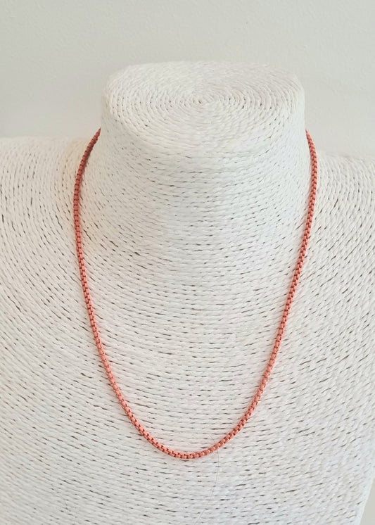 Pale orange enamelled metal necklace